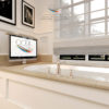 Our bathroom TV has a popup or dropdown lift that can be installed in your tub.