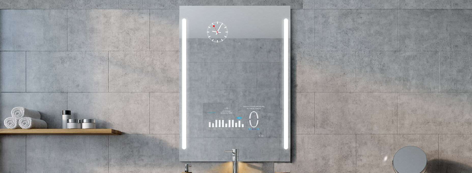 A smart bathroom mirror with its TV turned off mounted to the tiled wall of a bathroom